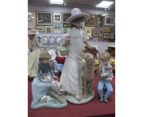 Nao Figure of a Young Girl with Dog; another with rabbits and a young boy with bandaged puppy. (3)