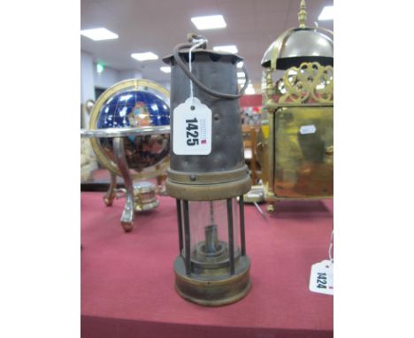 Miners Lamp, numbered '54' and '19' to brass centre rims, 24.5cm high with handle down.
