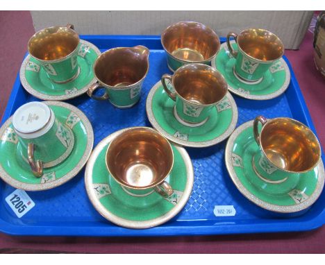 An Art Deco Crown Devon Fieldings Tea Service, with gilt decoration on a green ground, No 2686 to base of cups.