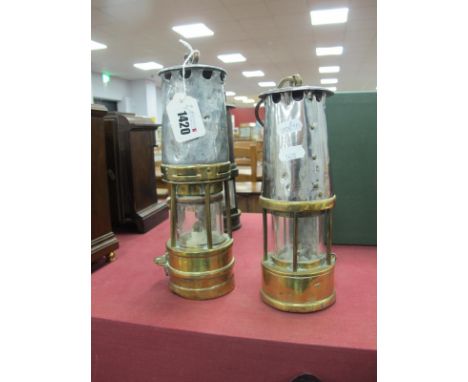 A Brass Based Miners Lamp, stamped '52' to aluminium upper section, 27cm high, with handle down, a smaller example. (2).