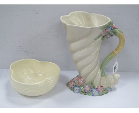 Clarice Cliff for Newport Pottery Cornucopia Jug Vase, of wrythen form with floral base and upper handle, 25cm high; a trifor