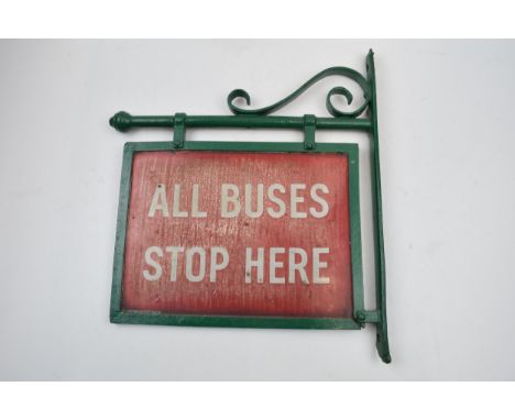 Original 'All Buses Stop Here' enamel sign mounted in metal frame, 36cm long.  