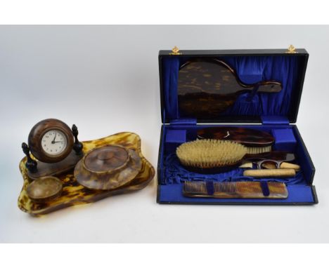 A vintage dressing table set with a tortoiseshell style clock, tray and jars with a travelling vanity set (2).  