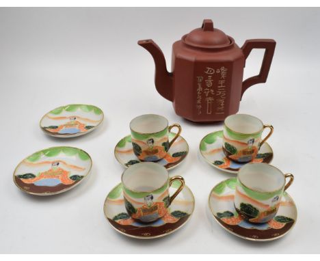 Vintage Japanese teapot together with set of four cups and saucers together with two spare plates.  