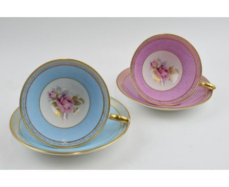 A pair of Aynsley cups and saucers with powder effect design and pink / cabbage rose style decoration (4).  In good condition