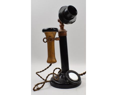 Early 20th century telephone on original flex with mirror panel. Height 32cm.  In good original condition.
