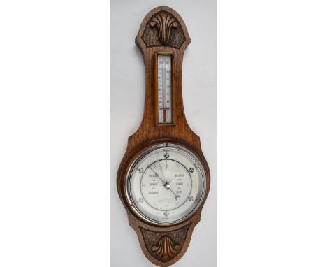 British made barometer and thermometer. Light oak mount and marked 551 to reverse.  crack to barometer glass.