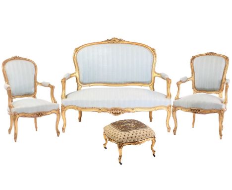 A French Louis XV-style carved wood and gilt gesso matched salon suite, late 19th century, the set comprises a pair of fauteu