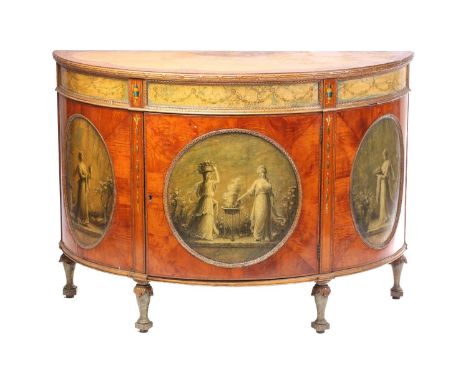 A George III style 'Sheraton Revival' satinwood and polychrome painted demi-lune commode, early 20th century, the single door