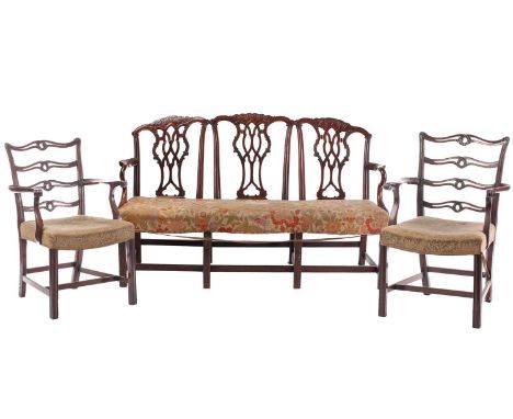 A Chippendale-style mahogany triple chair back settee, early 20th century, with shaped cresting rails, carved and pierced rib