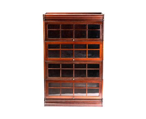 An early 20th century 'Globe Wernicke' style mahogany four-tier modular bookcase, with moulded top above four "window pane" g