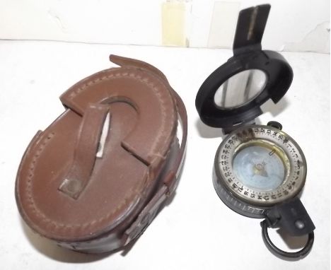 A military folding compass, marked "Enbeeco London, Made in England No. 3165A", in original case.