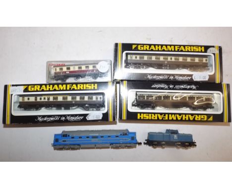 A Bachmann "Deltic" diesel locomotive, a Lima diesel D8915 locomotive and four carriages.