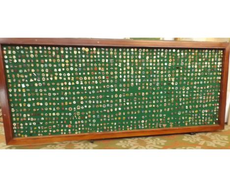 A large framed board (98x41 inches) containing approximately 1800 bowling badges, some earlier enamel.