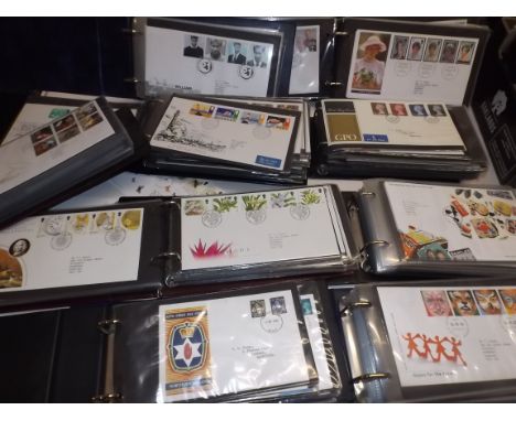 A collection of first day covers in nine albums.