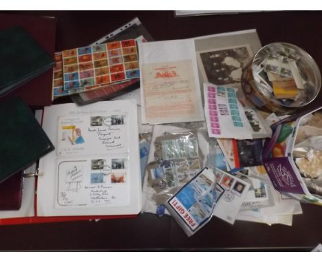 First day and other covers, loose stamps, together with five empty albums.