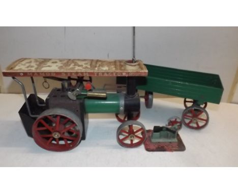 A Mamod live steam traction engine and a trailer.