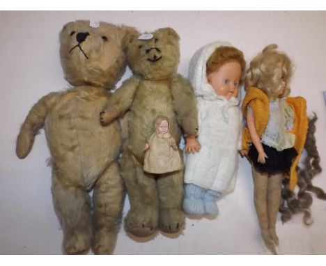 Two vintage teddy bears, largest 14", together with three dolls.
