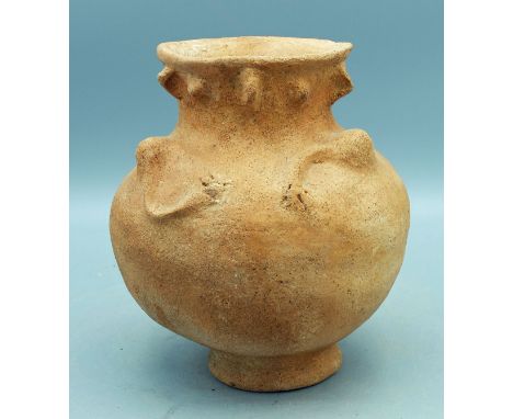 An unusual figural vessel from Panama, ca. 1000 - 1500 AD. It is 6-1/2 in. high, 5-1/2 in. in diameter and depicts an individ