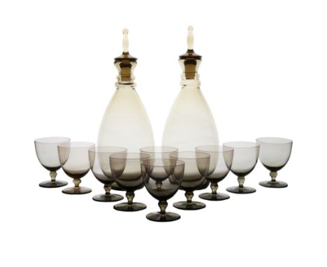 Orrefors decanter and wine glass set, circa 1960, the decanters with spike stoppers and grey brown colour with confirming gla