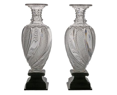 A pair of early 19th Century glass and bronze vases, circa 1810, French Empire, with arched cut and plan gadrooned body on br