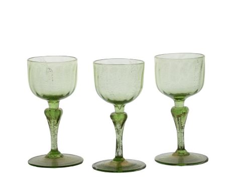 Three late 19th Century Murano wine glasses, Salviati, lime green glass with aventurine decoration, 12.5cm (3)