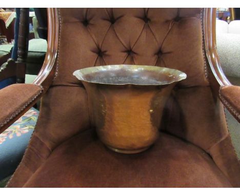 A brass hammered planter and a brass chamber stick with snuffer 