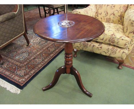 A circa 1840 mahogany circular top wine table on turned column and tripod base