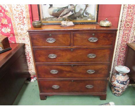 A Victorian mahogany two over three chest of drawers on shaped bracket feet 
