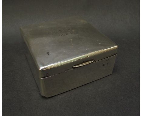 A silver square cigarette box, inscribed to top, London 1906