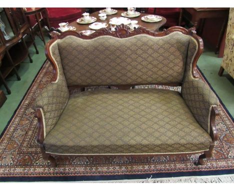 A Victorian carved mahogany two seater sofa, fabric back marked