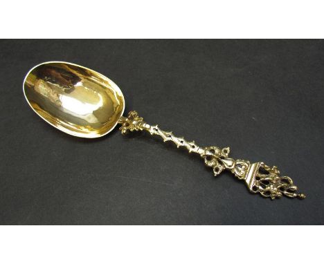 A Dutch gilded silver spoon with small hallmark to bowl, the spoon with cast decorative handle with figures on top, 42g