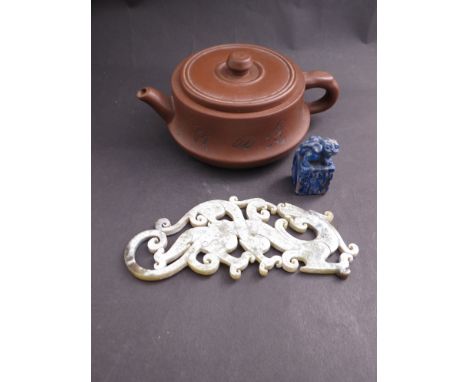 A Chinese lapis lazuli carved seal, a signed Yixing teapot, inscribed and of squat form and a finely carved Chinese archaisti