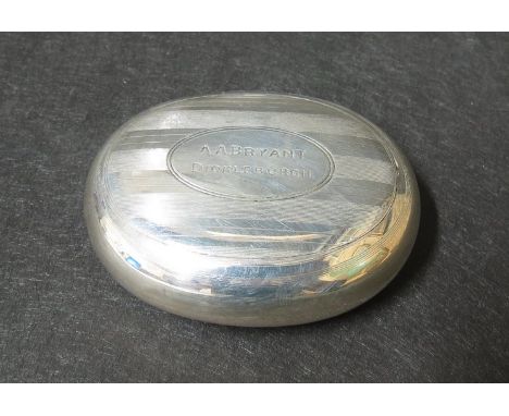 A George Unite silver rounded oval snuff box with squeeze release, engine line decoration, engraved cartouche, Birmingham 191