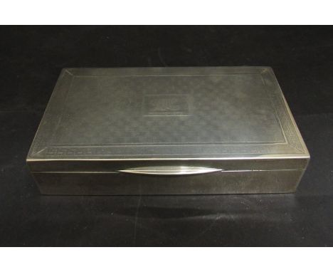 A silver cigarette case/box with engine turned detail, monogrammed, marks rubbed, 15cm long
