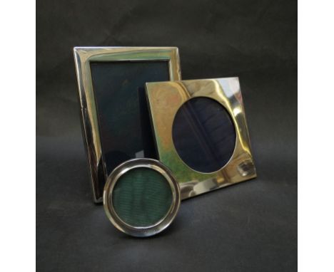 Three silver photo frames including square circular examples 