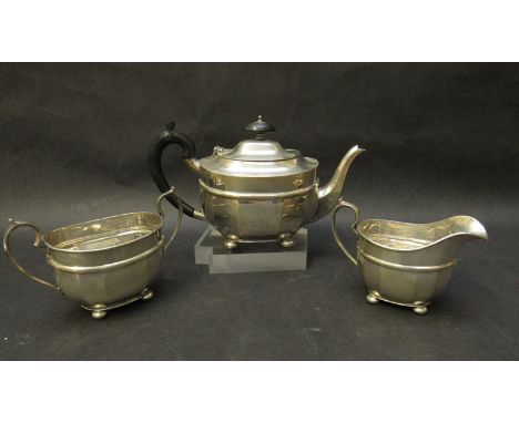 A silver three piece tea set by S. Blanckensee & Sons Ltd, teapot with treen handle and knop, marks rubbed, Chester 1929 and 