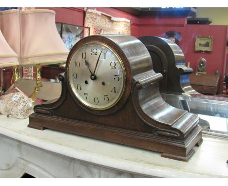 An early to mid 20th Century mantel clock with silvered dial, two train movement 
