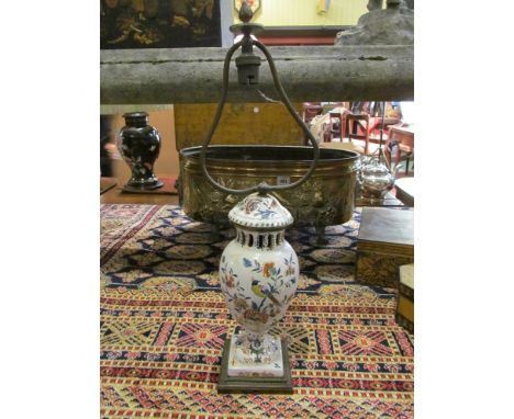 A Faience enamelled lamp base decorated with birds in foliage
