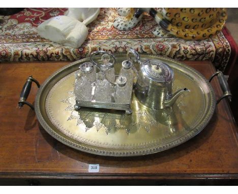 A plated Victorian serving tray, a plated engraved Victorian teapot and a plated condiments set with tray 