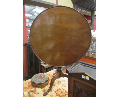 A George III mahogany tilt top table with tripod base (slight crack)