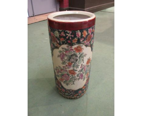 An Oriental ceramic stick stand with floral design