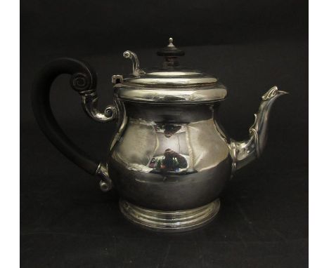 A Wakely and Wheeler silver teapot with ebony handle and knop, London 1922, 642g