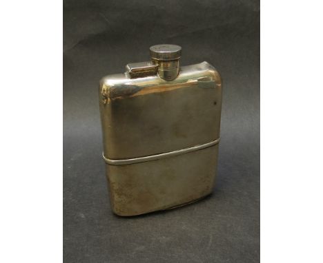 A Goldsmiths and Silversmiths silver hip flask, dented, 242g