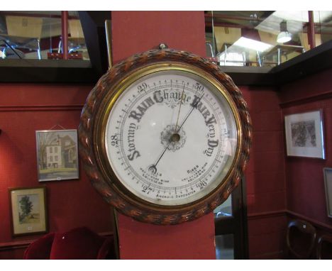 An early 20th Century oak rope twist dial barometer 