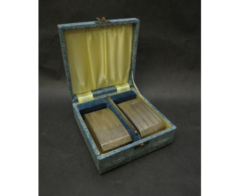 A boxed set of two silver brushes and comb, Birmingham 1955