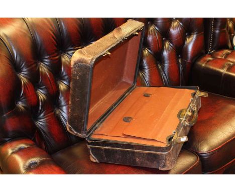 Vintage leather suitcase with fitted interior and shoe lasts