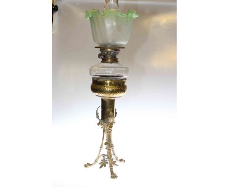 Ornate brass based oil lamp with glass reservoir and etched green tinted shade