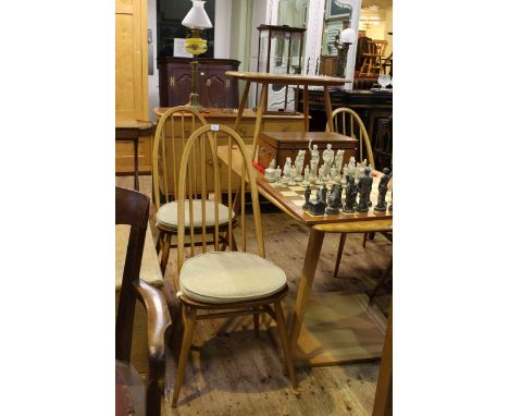 Vintage Ercol Windsor seven piece dining suite comprising three door sideboard 124cm wide, rectangular dining table 154cm lon