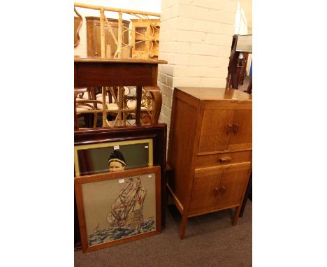 Four door oak record cabinet, cabriole leg occasional table, coffee table, framed coloured portrait and framed needlework (5)